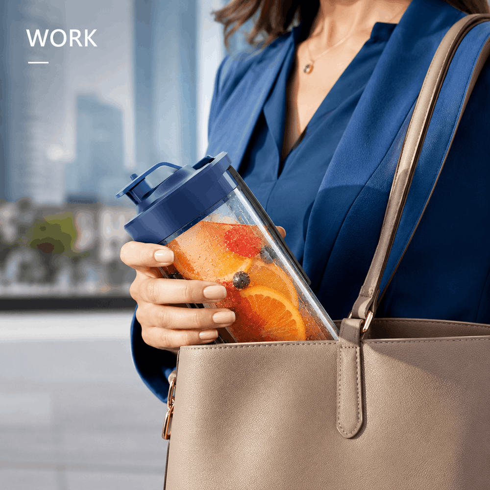 A woman in a blue blazer carries a clear water bottle with a dark blue lid in one hand while placing it into a beige tote bag. The scene is set in a blurred office environment with the word 'WORK' in the top left corner.