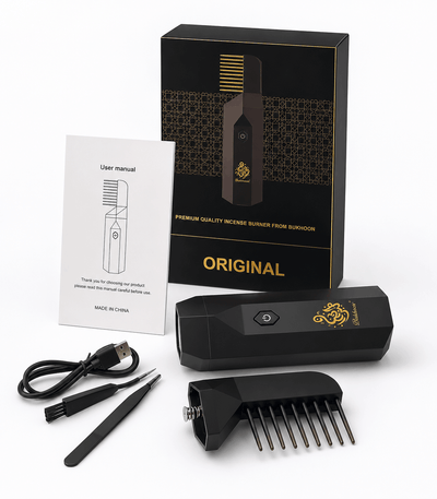 Electric hair bakhoor comb unboxing kit including the black device body, comb attachment, USB cable, tweezers, and user manual