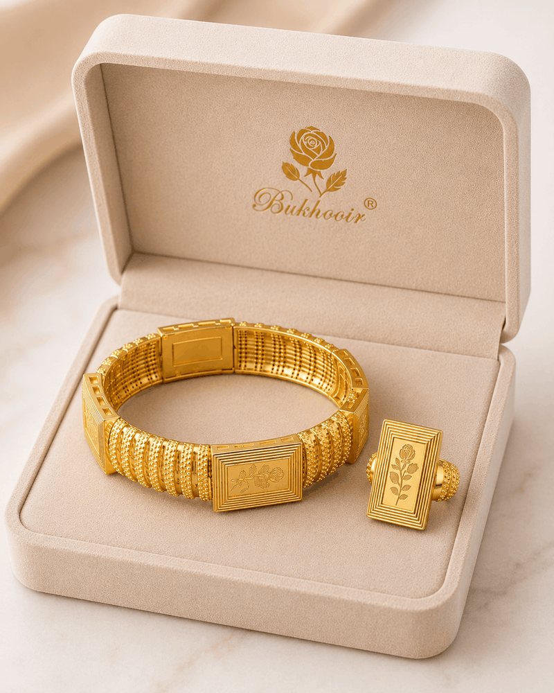Woman Empress Rose Jewelry Set featuring a matching gold bangle and ring with an embossed rose motif